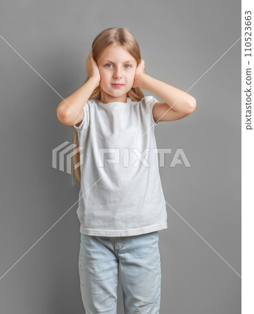 Little girl holding her head. Little girl holding her head. 110523663