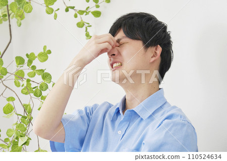 A man with eyestrain 110524634