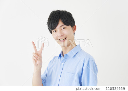 A man making a peace sign, white background A man making a peace sign, white background 110524639