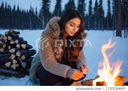 young traveler hiker women hands warm by the fire. She sit near the flame. Caucasian woman warms hands near small bonfire at winter wilderness evening. Travel, Survival, lifestyle concept.. AI young traveler hiker women hands warm by the fire. She sit near the flame. Caucasian woman warms hands near small bonfire at winter wilderness evening. Travel, Survival, lifestyle concept.. AI 110526464