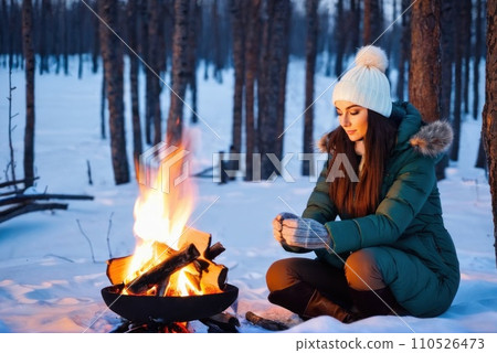 young traveler hiker women hands warm by the fire. She sit near the flame. Caucasian woman warms hands near small bonfire at winter wilderness evening. Travel, Survival, lifestyle concept.. AI young traveler hiker women hands warm by the fire. She sit near the flame. Caucasian woman warms hands near small bonfire at winter wilderness evening. Travel, Survival, lifestyle concept.. AI 110526473