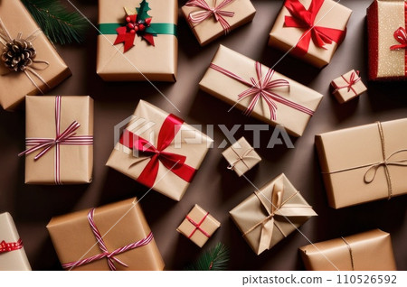 Winter Holidays Concept, Christmas Gifts Wrapped in Craft Paper with Red and Golden Ribbon, Top View. Overhead view of many Christmas presents wrapped with craft paper on paper surface. AI 110526592