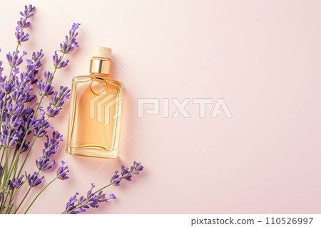 Elegant flat lay of body oils and perfume bottles with lavender sprigs on a pastel background, minimalist style Elegant flat lay of body oils and perfume bottles with lavender sprigs on a pastel background, minimalist style 110526997