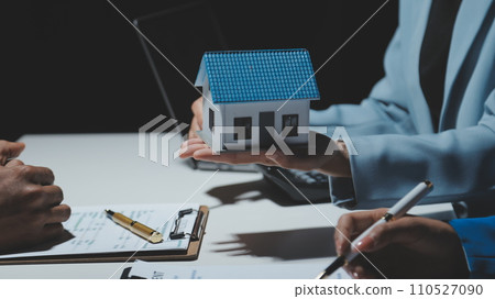 Real estate agent and customer signing contract to buy house, insurance or loan real estate.rent a house,get insurance or loan real estate or property. Real estate agent and customer signing contract to buy house, insurance or loan real estate.rent a house,get insurance or loan real estate or property. 110527090