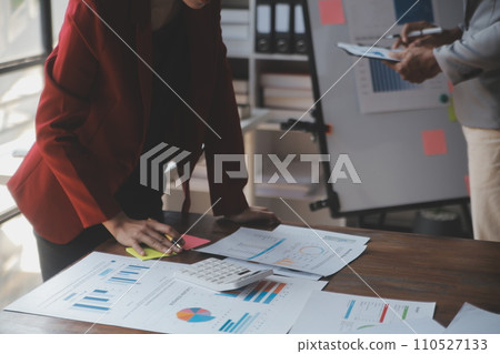 Close up of Business team analyzing income charts and graphs with modern laptop computer. Business analysis and strategy concept. 110527133