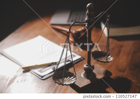 image of judge's hammer, scales lady of justice, law book, laptop computer and contract documents with pen concept of law and justice. 110527147