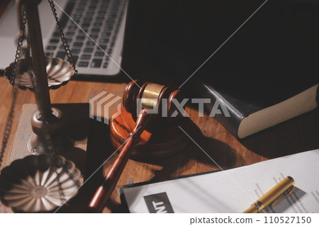 image of judge's hammer, scales lady of justice, law book, laptop computer and contract documents with pen concept of law and justice. image of judge's hammer, scales lady of justice, law book, laptop computer and contract documents with pen concept of law and justice. 110527150