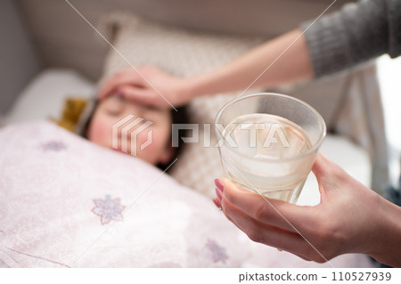 mother's hands caring for her child 110527939