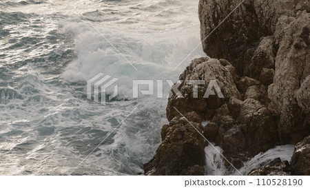 sea waves crushing over rocks with soft light 110528190