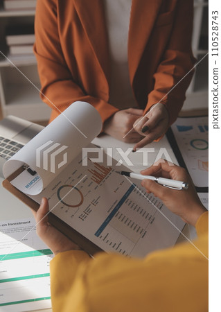 .Team of business people working together in the meeting room office, teamwork background charts and graphs banner, double exposure successful teamwork,business planning concept. .Team of business people working together in the meeting room office, teamwork background charts and graphs banner, double exposure successful teamwork,business planning concept. 110528743