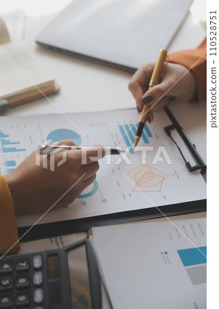 .Team of business people working together in the meeting room office, teamwork background charts and graphs banner, double exposure successful teamwork,business planning concept. .Team of business people working together in the meeting room office, teamwork background charts and graphs banner, double exposure successful teamwork,business planning concept. 110528751