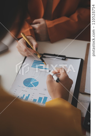 .Team of business people working together in the meeting room office, teamwork background charts and graphs banner, double exposure successful teamwork,business planning concept. .Team of business people working together in the meeting room office, teamwork background charts and graphs banner, double exposure successful teamwork,business planning concept. 110528754