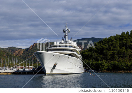 Luxury super yacht moored alongside in marina. Forward view. Motor yacht. Yachting concept. 110530546