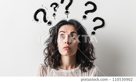 Portrait of a woman with perplexed facial expression; some black question marks above her head Portrait of a woman with perplexed facial expression; some black question marks above her head 110530902