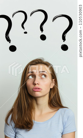 Portrait of a woman with perplexed facial expression; some black question marks above her head Portrait of a woman with perplexed facial expression; some black question marks above her head 110530903