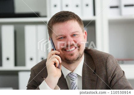 Handsome smiling businessman talk cellphone Handsome smiling businessman talk cellphone 110530914
