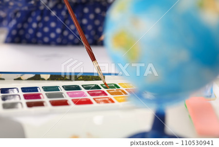 Brush point in watercolor paint closeup Brush point in watercolor paint closeup 110530941