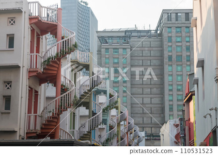 Closeup colorful exterior spiral staircases of shophouse, Singapore 110531523