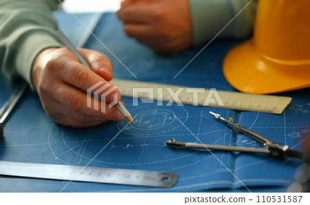 Male hand holding pencil in hand. 110531587
