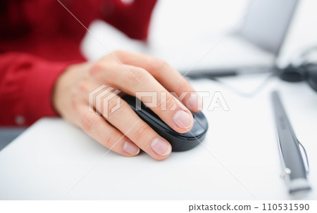 Male hand used computer mose holding in arm 110531590