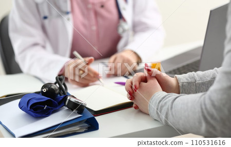 Female doctor hand hold silver pen Female doctor hand hold silver pen 110531616