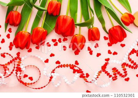 Red tulips and hearts on pink background Red tulips and hearts on pink background 110532301