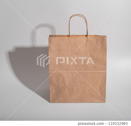 Beige brown kraft paper bag with shadow 110532965