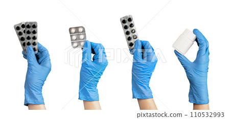 Hand holding pills, drugs, medicines in blisters and jar set, isolated on white 110532993