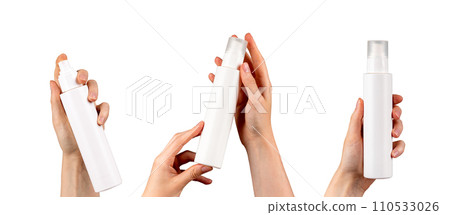 Plastic spray cosmetic bottle, blank beauty product package in hand set, isolated on white 110533026