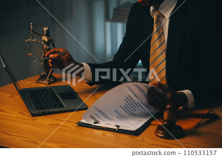 Judge gavel with Justice lawyers having team meeting at law firm background. Concepts of Law and Legal services. Judge gavel with Justice lawyers having team meeting at law firm background. Concepts of Law and Legal services. 110533157