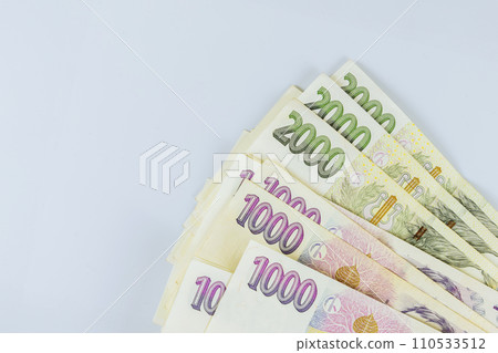 Different value stacked money bills of Czech Republic koruna CZK banknotes cash currency at white background 110533512