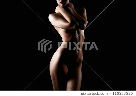 Nude Woman silhouette in the dark. Beautiful Naked Body Girl Nude Woman silhouette in the dark. Beautiful Naked Body Girl 110533530