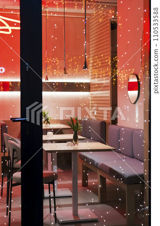 a restaurant or cafe. Tables and chairs in the outdoor restaurant. There are no visitors at the restaurant for dinner. a restaurant or cafe. Tables and chairs in the outdoor restaurant. There are no visitors at the restaurant for dinner. 110533588