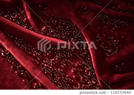Abstract background from red beads on red velvet. Abstract background from red beads on red velvet. 110533640