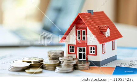 House and stack of coins with white background. Home savings concept. Energy saving. Cost of the house. Cost of living. Savings for home goal. Dreaming of home. 110534282