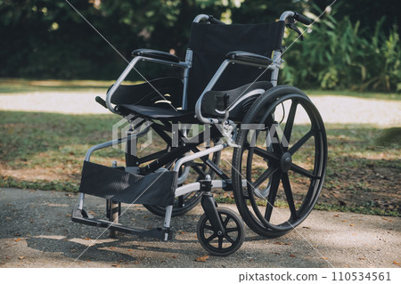 Single wheelchair parked in hospital hallway Single wheelchair parked in hospital hallway 110534561