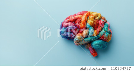 Human brain made of multi-colored tangled threads on blue background, banner with copy space, concept of neurodiversity and mental problems 110534757