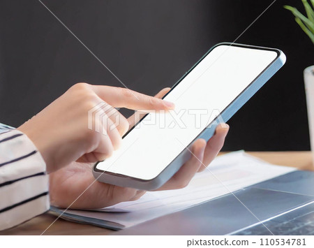 Woman's hand operating a smartphone, business woman 110534781