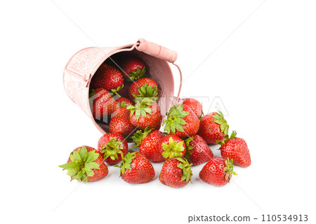 Ripe strawberries in a bucket isolated on a white background. 110534913
