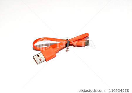 Orange smartphone charging cable on white. 110534978