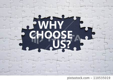 Why choose us symbol. Concept words Why choose us on white puzzle. Beautiful deep blue background. Business and Why choose us concept. Copy space. 110535019