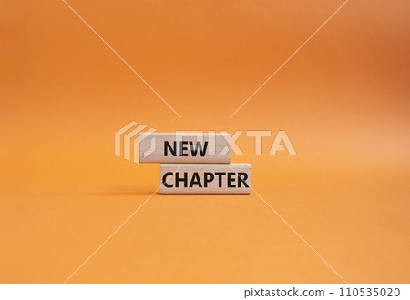 New Chapter symbol. Concept word New Chapter on wooden blocks. Beautiful orange background. Business and New Chapter concept. Copy space New Chapter symbol. Concept word New Chapter on wooden blocks. Beautiful orange background. Business and New Chapter concept. Copy space 110535020