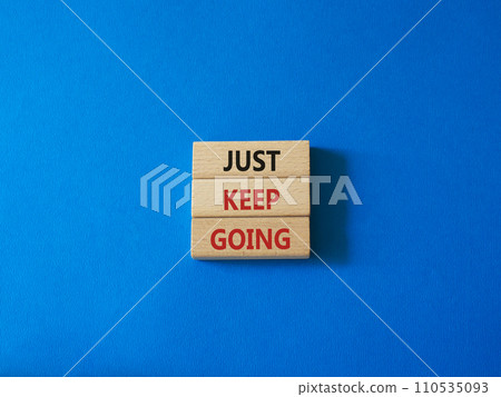 Just keep going symbol. Concept words Just keep going on wooden blocks. Beautiful blue background. Business and Just keep going concept. Copy space. Just keep going symbol. Concept words Just keep going on wooden blocks. Beautiful blue background. Business and Just keep going concept. Copy space. 110535093