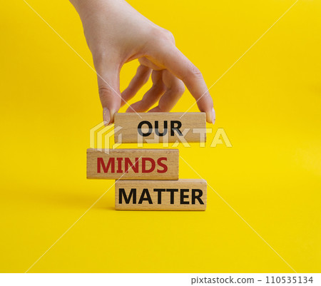 Our Minds Matter symbol. Concept words Our Minds Matter on wooden blocks. Doctor hand. Beautiful yellow background. Psychological social and Our Minds Matter concept. Copy space. 110535134
