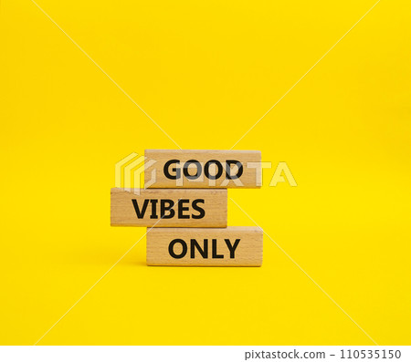 Good Vibes only symbol. Concept words Good Vibes only on wooden blocks. Beautiful yellow background. Business and Good Vibes only concept. Copy space. 110535150