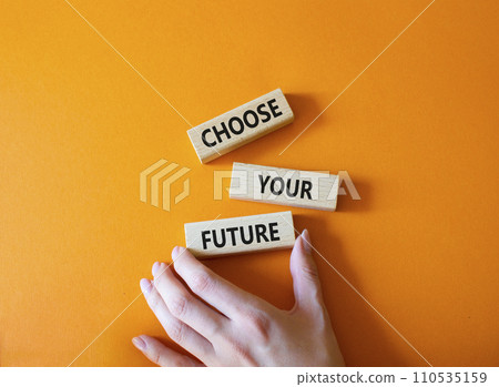 Choose your future symbol. Wooden blocks with words Choose your future. Beautiful orange background. Businessman hand. Business and Choose your future concept. Copy space. 110535159