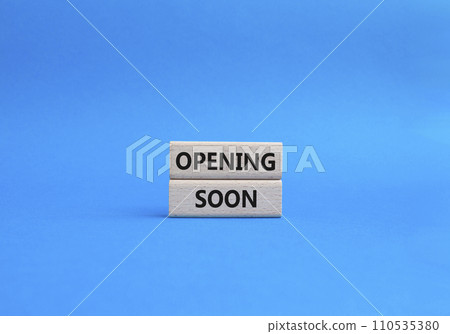 Opening soon symbol. Concept word Opening soon on wooden blocks. Beautiful blue background. Business and Opening soon concept. Copy space 110535380