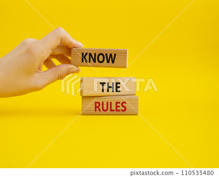 Know the rules symbol. Wooden blocks with words Know the rules. Beautiful yellow background. Businessman hand. Business and Know the rules concept. Copy space. Know the rules symbol. Wooden blocks with words Know the rules. Beautiful yellow background. Businessman hand. Business and Know the rules concept. Copy space. 110535480