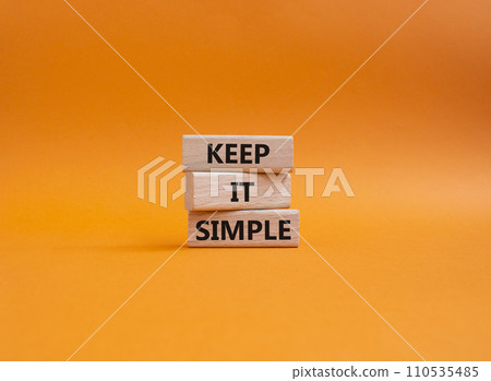 Keep it Simple symbol. Concept words Keep it Simple on wooden blocks. Beautiful orange background. Business and Keep it Simple concept. Copy space. 110535485