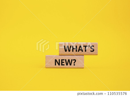 What is new symbol. Concept word What is new on wooden blocks. Beautiful yellow background. Business and What is new concept. Copy space What is new symbol. Concept word What is new on wooden blocks. Beautiful yellow background. Business and What is new concept. Copy space 110535576
